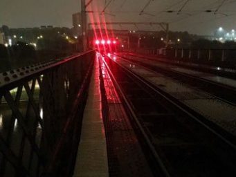 Railway bridge and rail tracks at night