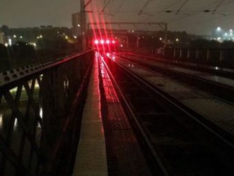 Railway bridge and rail tracks at night