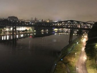 Railway bridge over a river at night